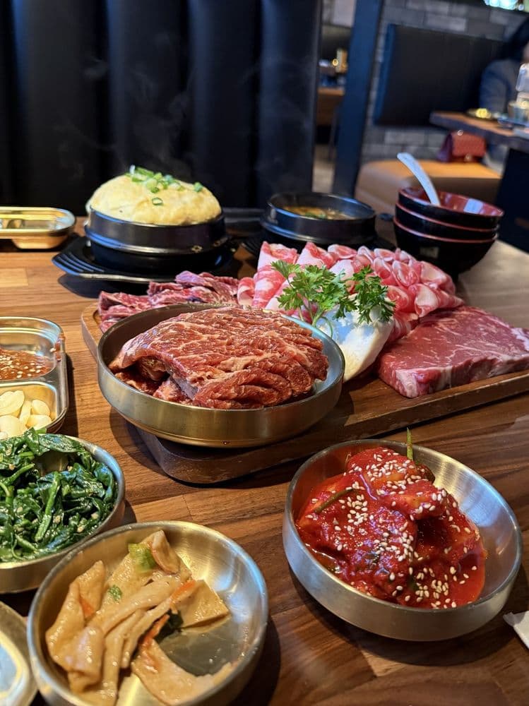 Full HAAN table spread — meat, banchan, steamed egg